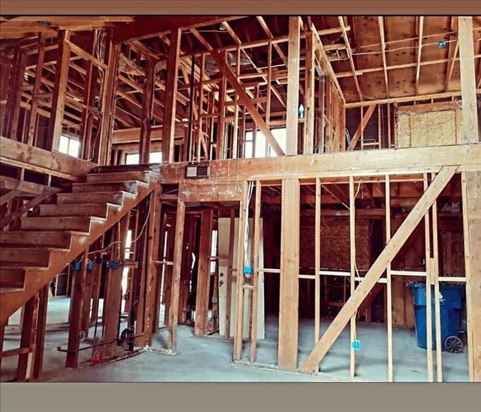The interior of a 2 story home showing only framing work.
