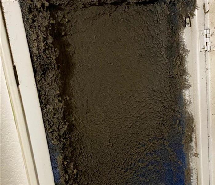 Air duct full of black dirt, dust and soot. 